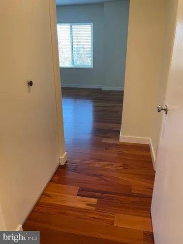 a kitchen with stainless steel appliances a refrigerator sink and white cabinets