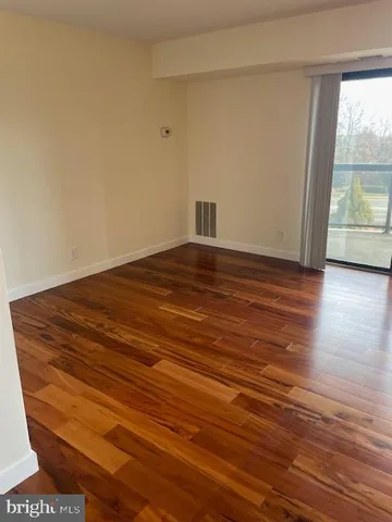 a view of a livingroom with furniture and a potted plant