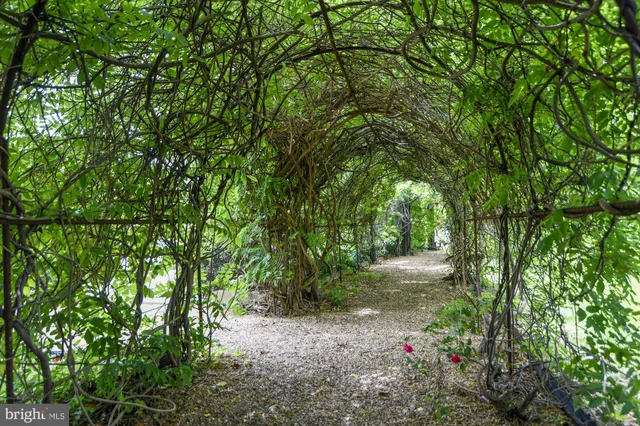 a front view of a building with garden
