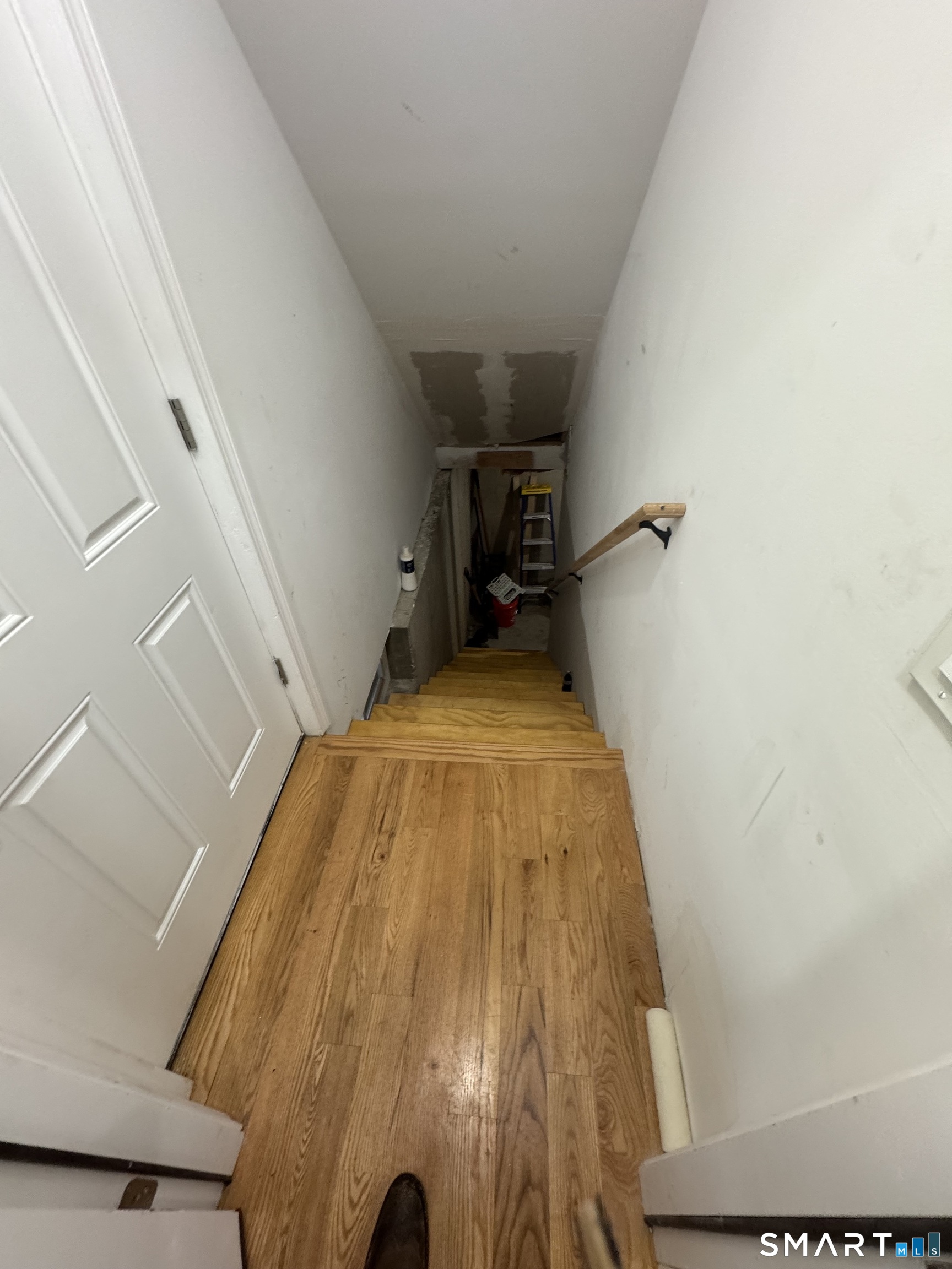 695 Shelton Street Bridgeport, CT 06608 - Photo 31 of 36 a bed sitting in a bedroom next to a window