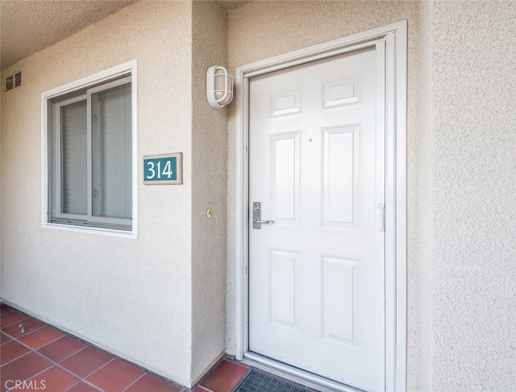 200 Pacific Coast Highway, Unit 314 Huntington Beach, CA 92648 - Photo 1 of 26 a view of front door with hallway