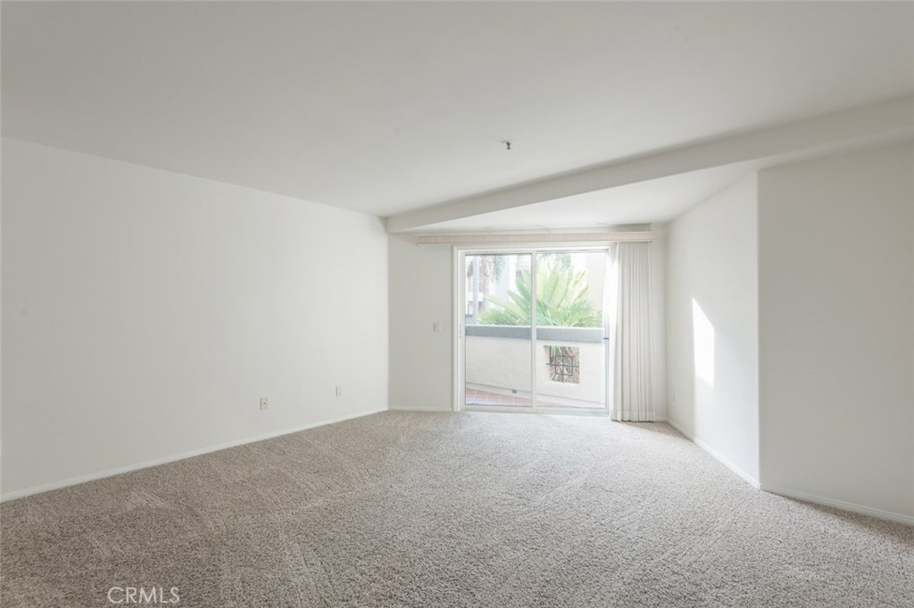 200 Pacific Coast Highway, Unit 314 Huntington Beach, CA 92648 - Photo 8 of 26 a view of an empty room with a window