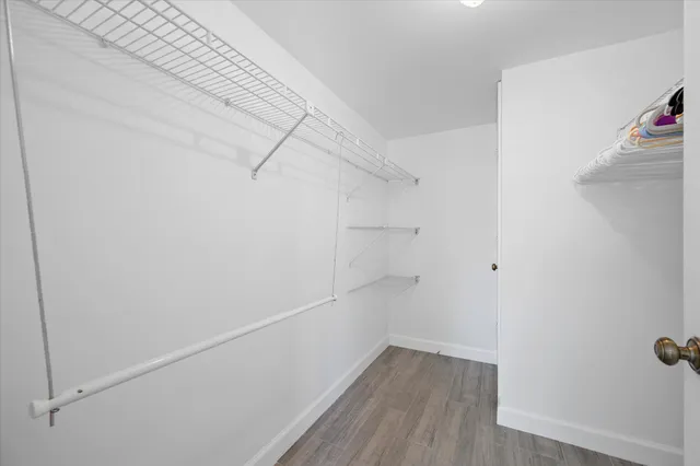 a bathroom with a sink a toilet and a shower curtain