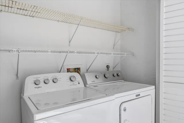 a view of a garden with a building in the background