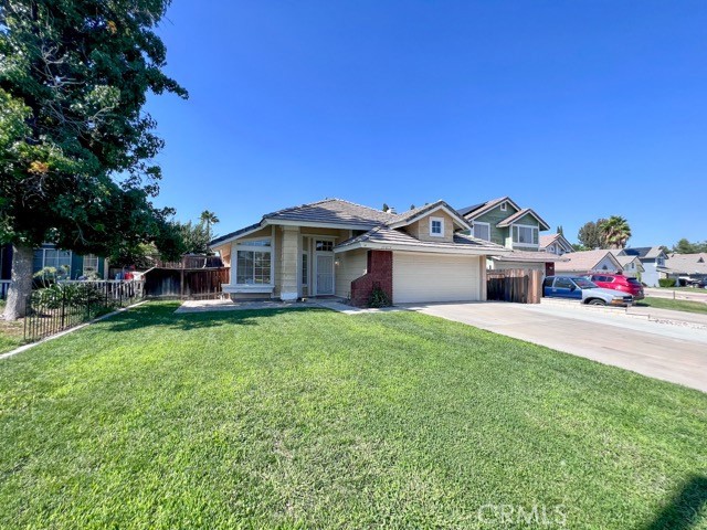 39879 Osprey Road Murrieta, CA 92562 - Photo 2 of 38 a front view of a house with a garden and yard