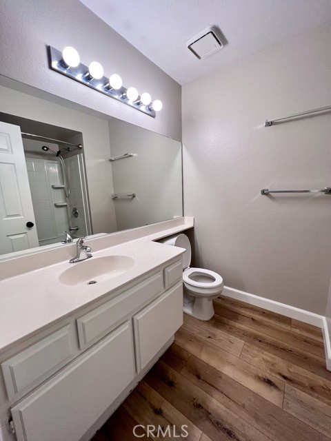 39879 Osprey Road Murrieta, CA 92562 - Photo 23 of 38 a bathroom with a sink a toilet and mirror
