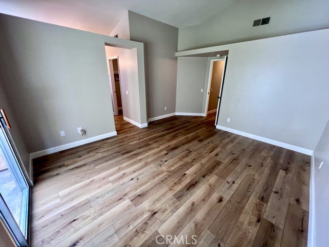 39879 Osprey Road Murrieta, CA 92562 - Photo 26 of 38 a view of an empty room with wooden floor and a window