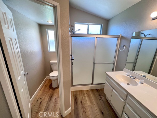 39879 Osprey Road Murrieta, CA 92562 - Photo 28 of 38 a bathroom with a sink a toilet a shower and a mirror
