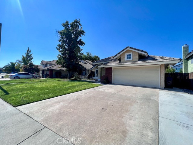 39879 Osprey Road Murrieta, CA 92562 - Photo 3 of 38 a front view of a house with a yard and garage