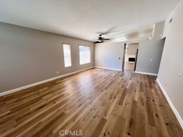 39879 Osprey Road Murrieta, CA 92562 - Photo 5 of 38 a view of empty room with wooden floor and fan