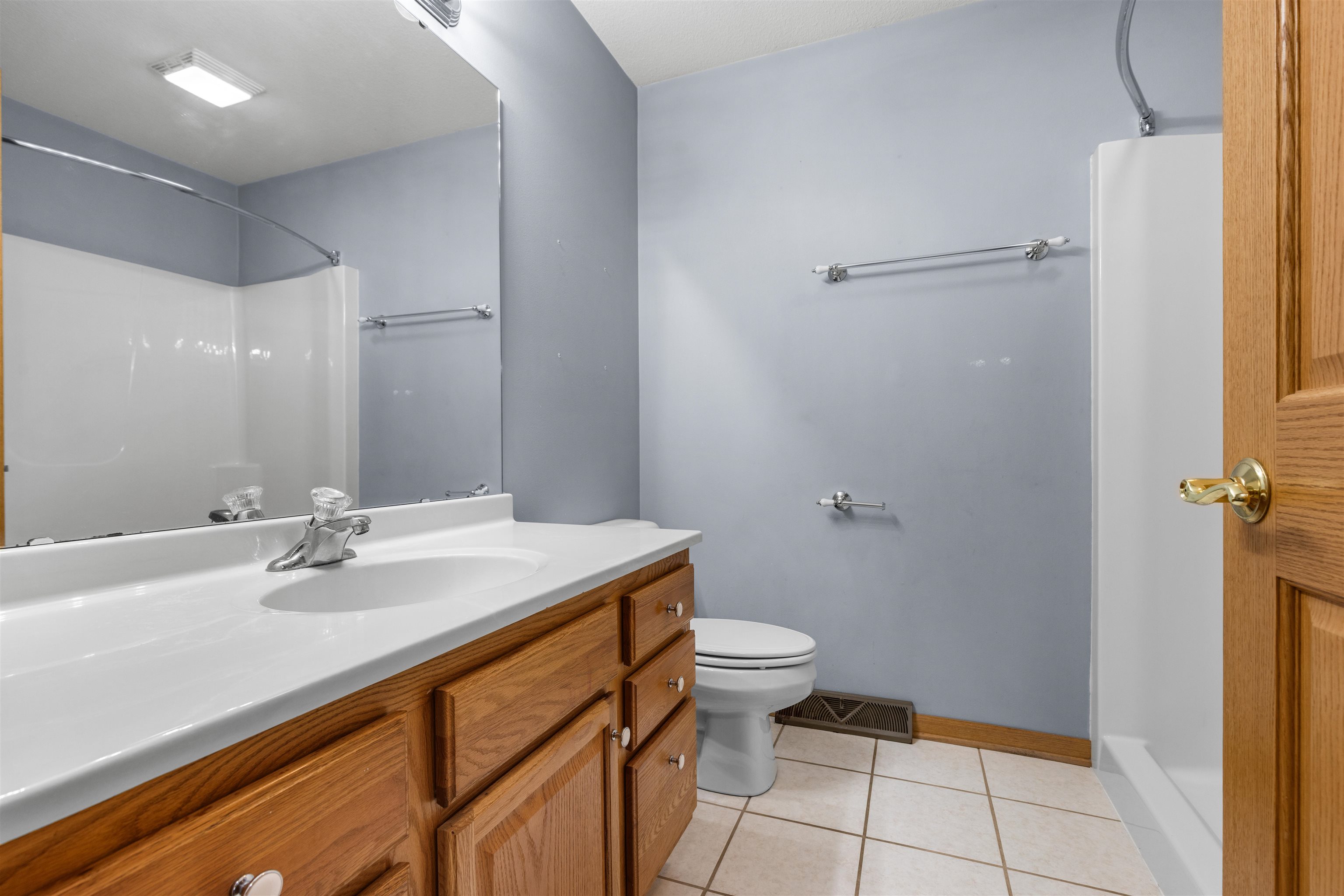 607 South 6th Street Oregon, IL 61061 - Photo 11 of 23 a bathroom with a sink and a mirror