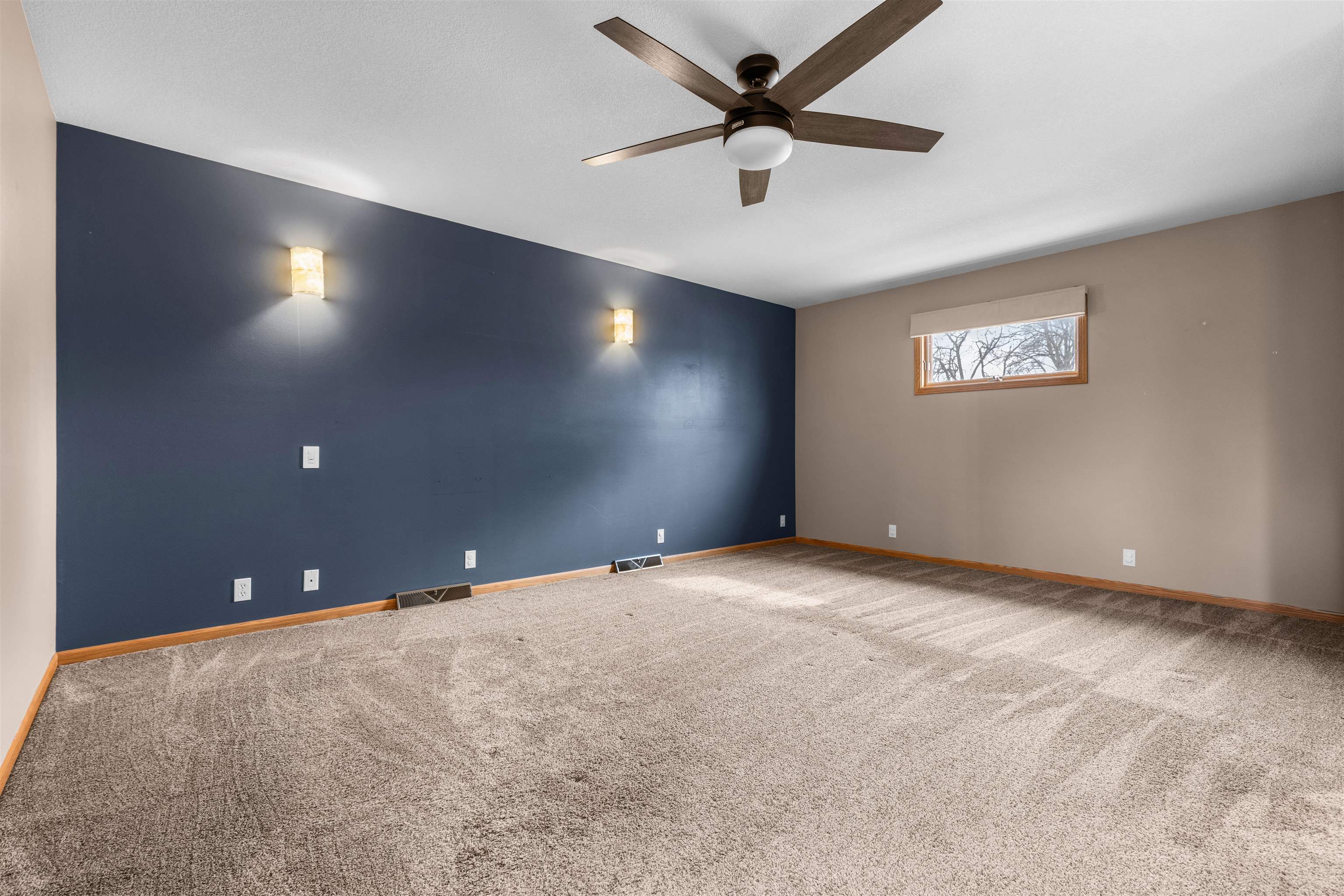 607 South 6th Street Oregon, IL 61061 - Photo 14 of 23 an empty room with a ceiling fan and window
