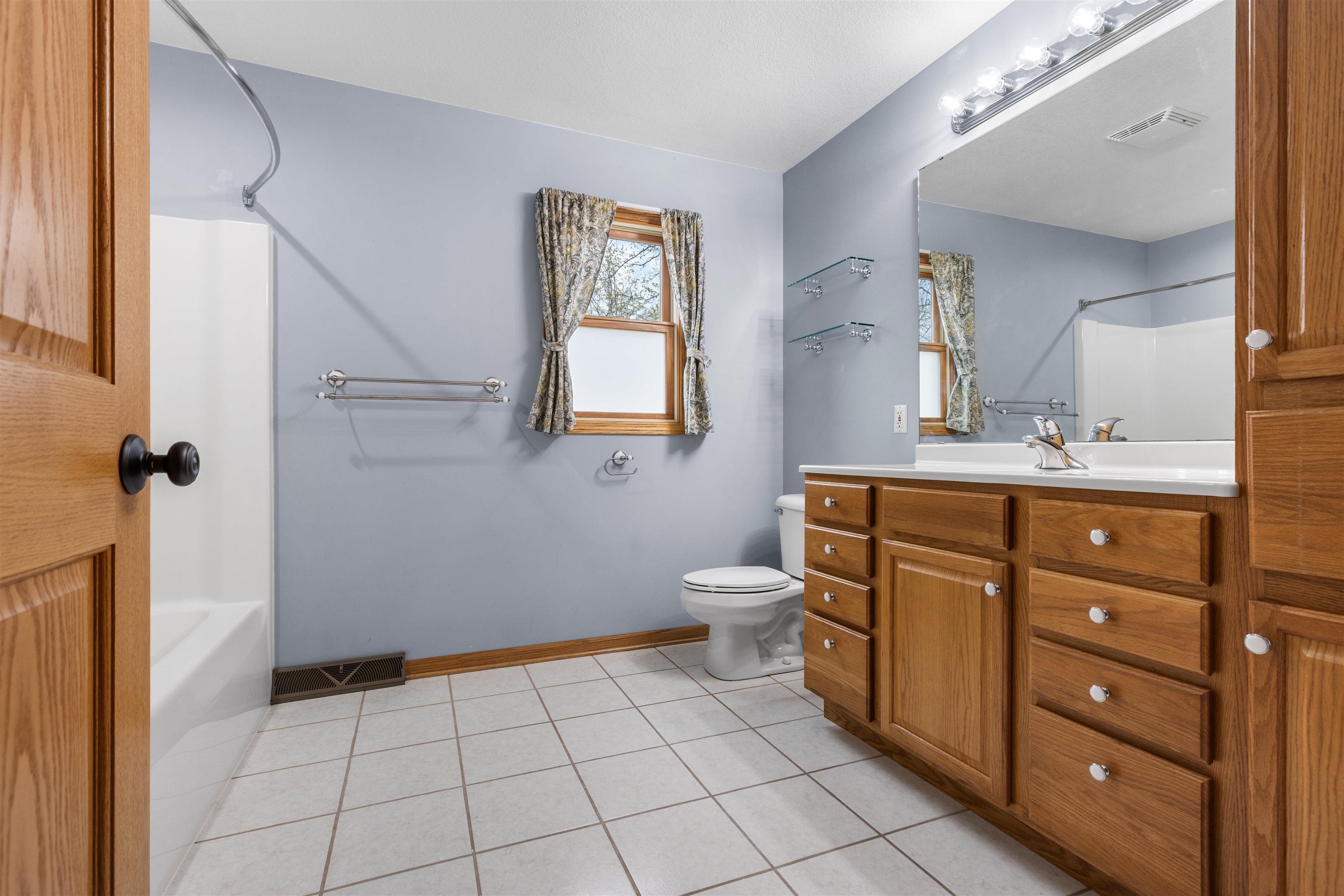 607 South 6th Street Oregon, IL 61061 - Photo 17 of 23 a bathroom with a sink toilet and mirror