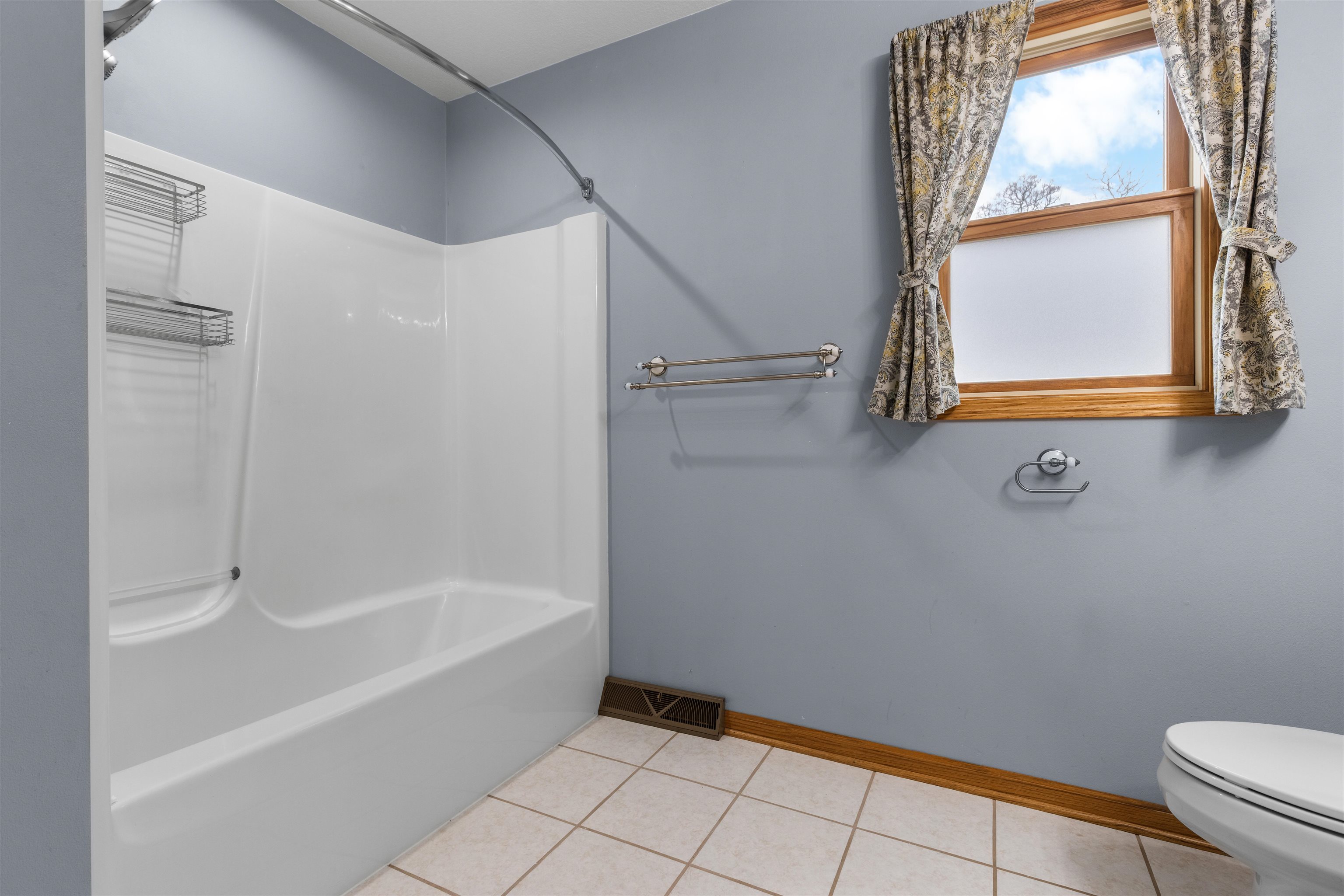 607 South 6th Street Oregon, IL 61061 - Photo 18 of 23 a bathroom with a bathtub and a window