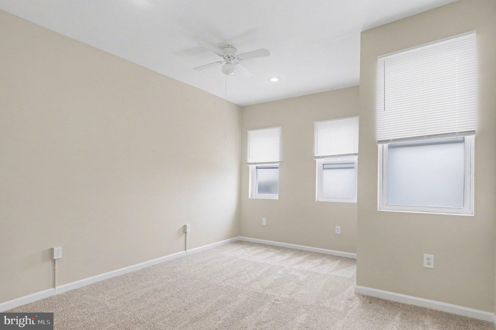 3418 East Baltimore Street Baltimore, MD 21224 - Photo 17 of 40 an empty room with windows and closet