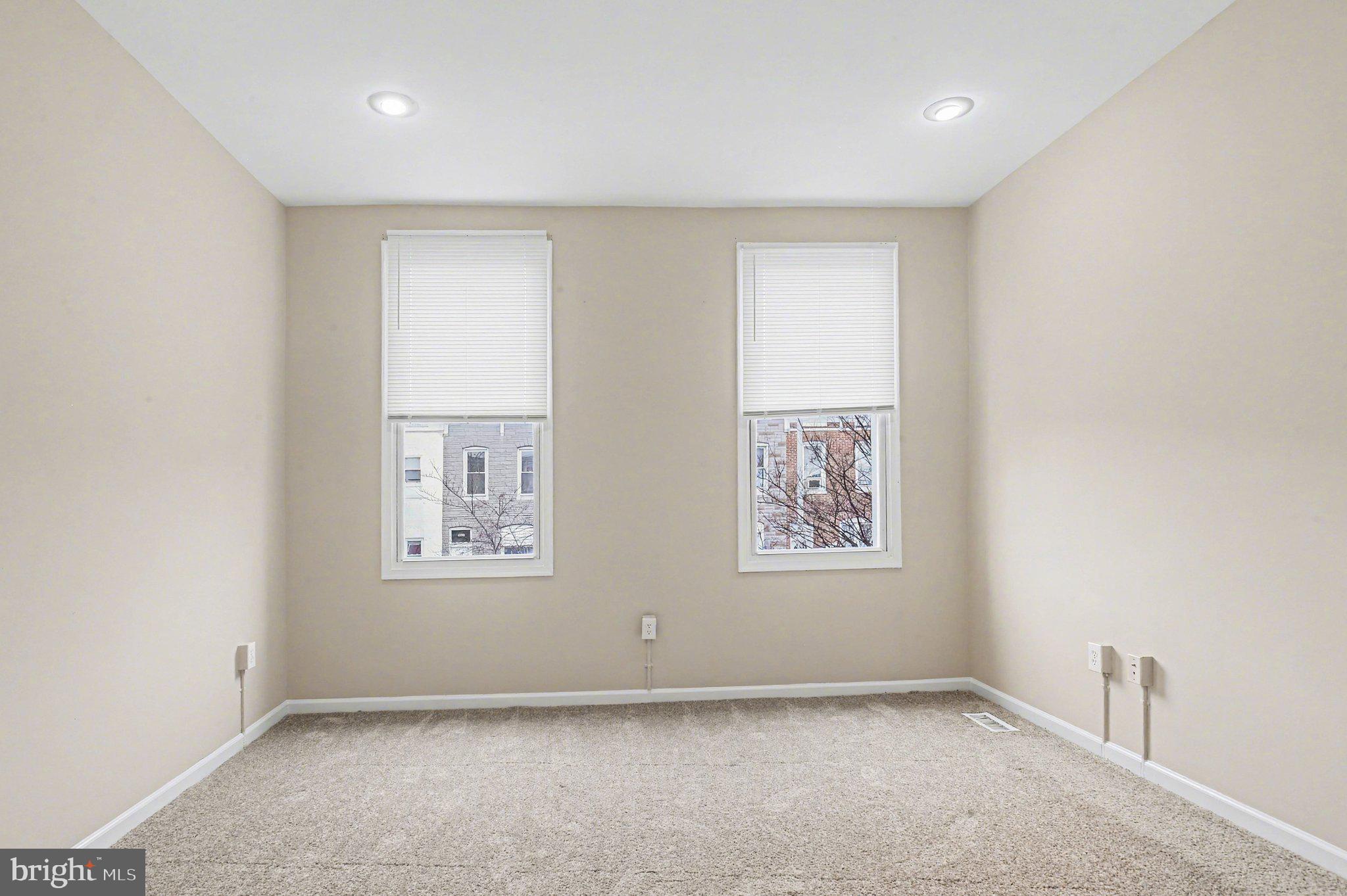 3418 East Baltimore Street Baltimore, MD 21224 - Photo 23 of 40 an empty room with windows