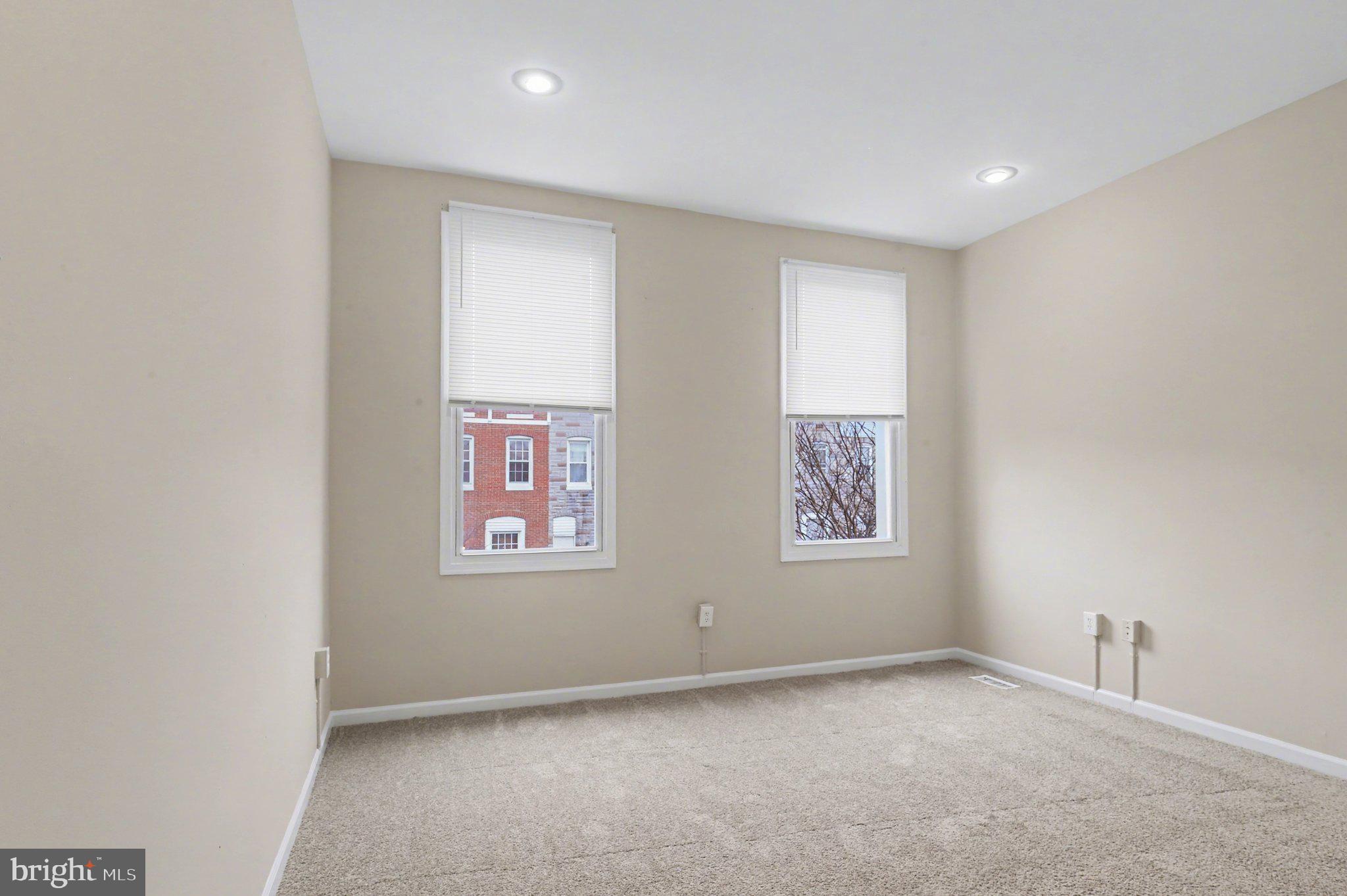 3418 East Baltimore Street Baltimore, MD 21224 - Photo 24 of 40 an empty room with windows