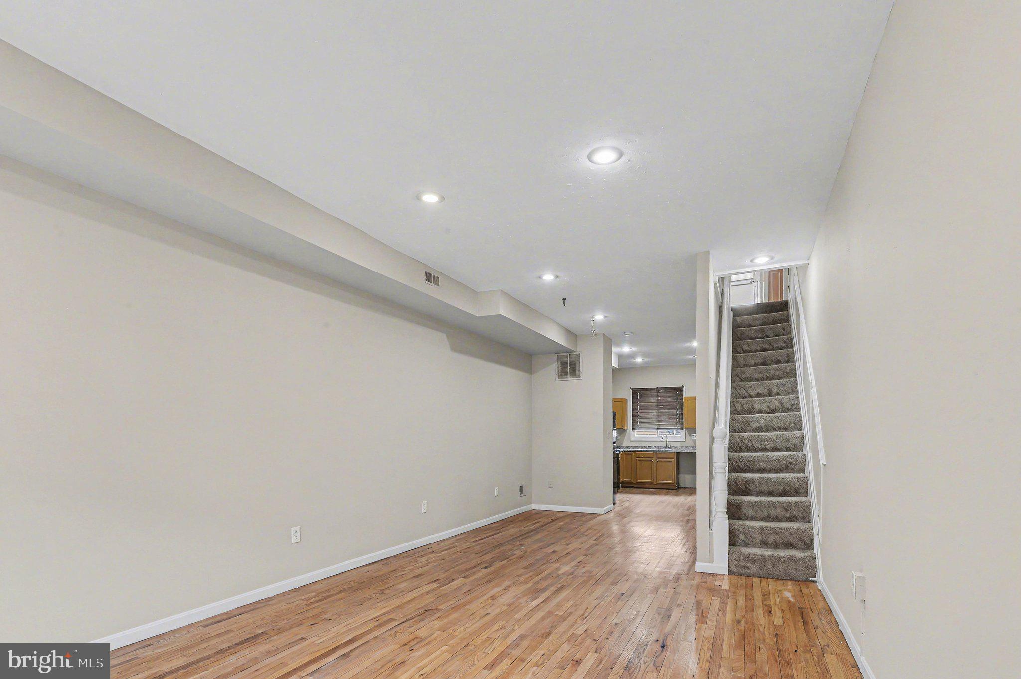 3418 East Baltimore Street Baltimore, MD 21224 - Photo 4 of 40 a view of room and wooden floor