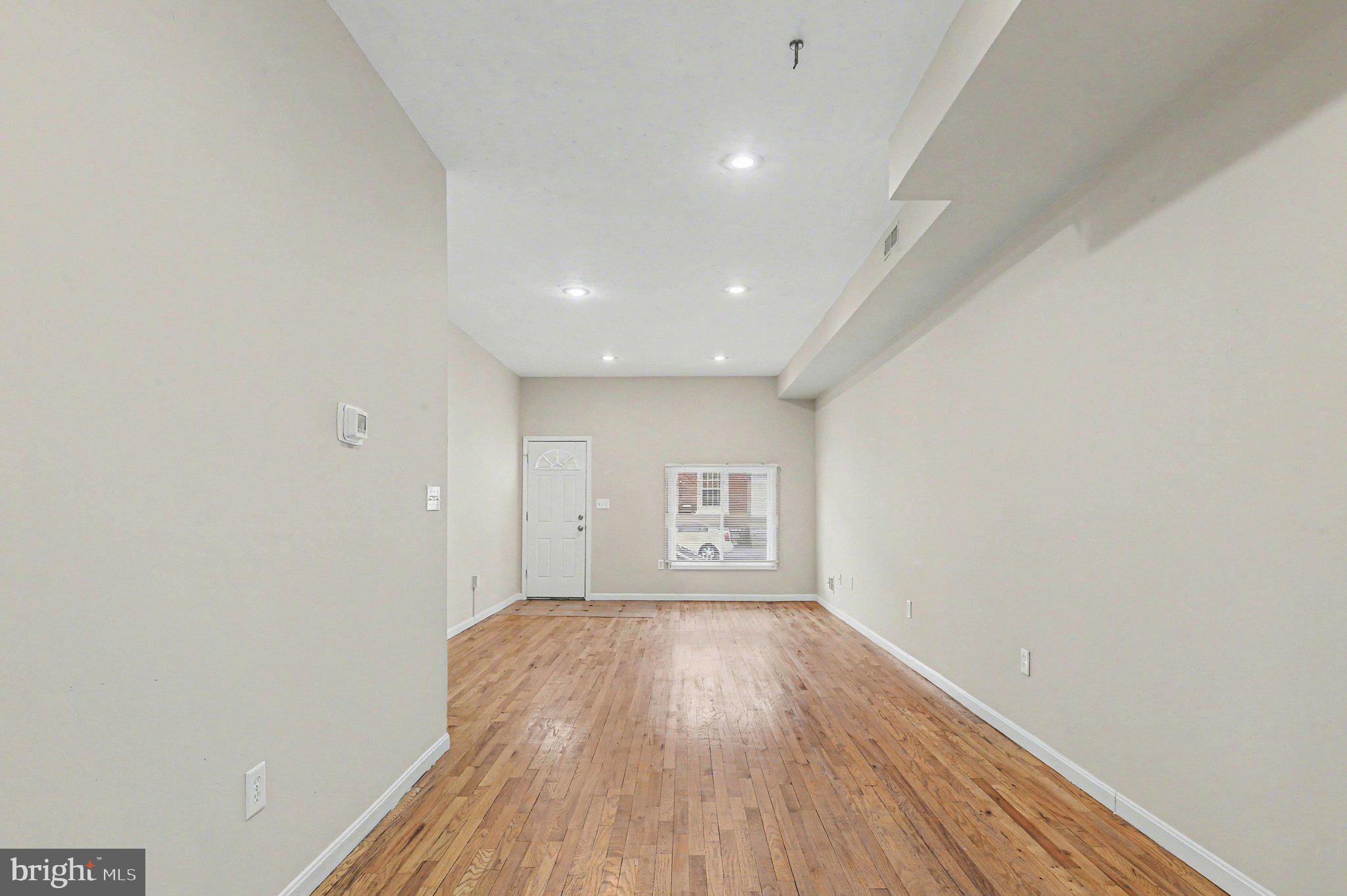 3418 East Baltimore Street Baltimore, MD 21224 - Photo 8 of 40 a view of empty room with wooden floor