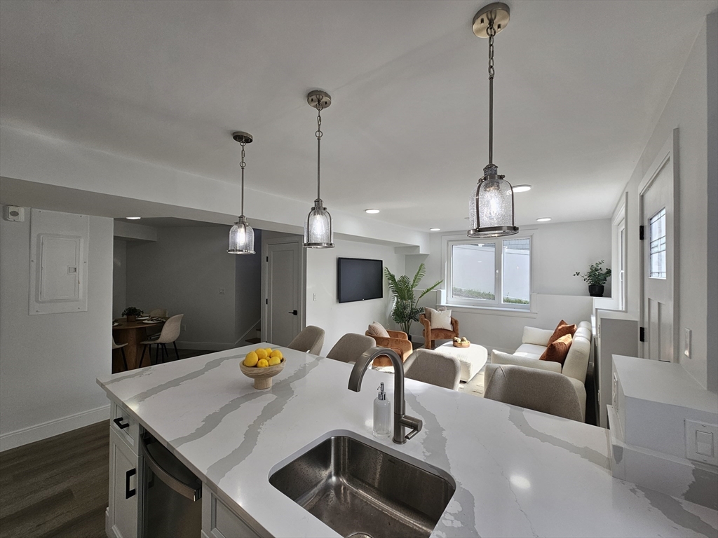 a view of a room with furniture and chandelier