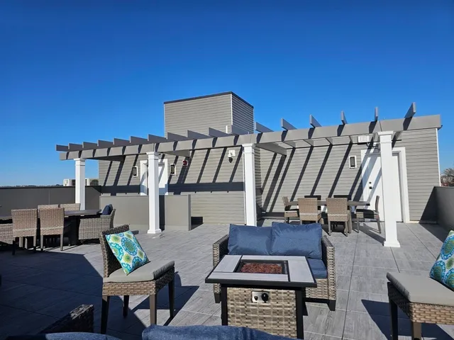 a view of entryway livingroom and hall with wooden floor