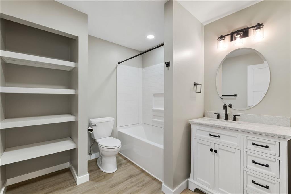 300 Gilkeson Road, Unit 10B Pittsburgh, PA 15228 - Photo 26 of 31 a bathroom with a sink a toilet and a mirror