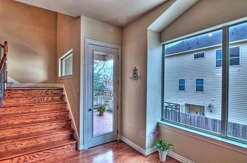 3505 Jackson Street Houston, TX 77004 - Photo 14 of 32 a view of a balcony with wooden floor and stairs