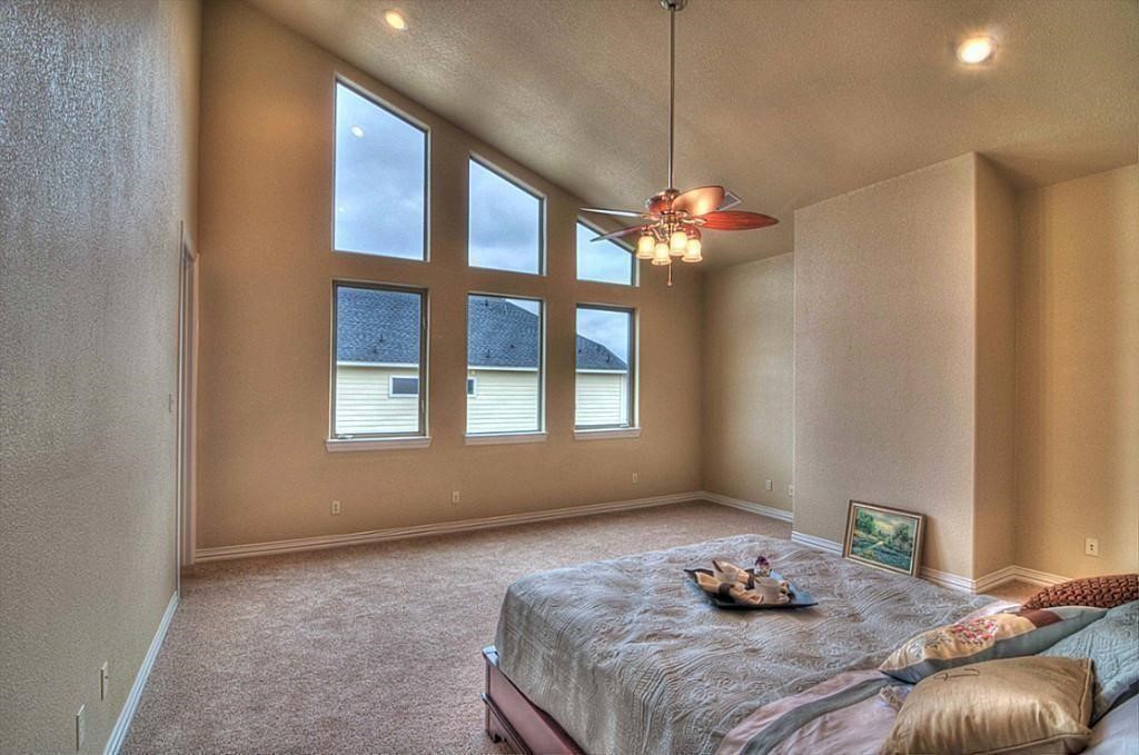 3505 Jackson Street Houston, TX 77004 - Photo 18 of 32 a bedroom with a bed and a window