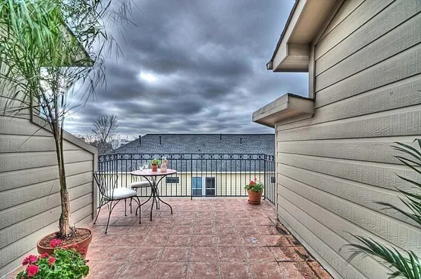 a view of a chairs and table in the patio