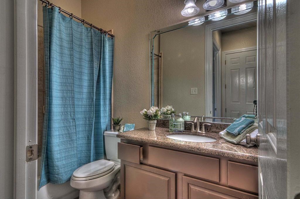 3505 Jackson Street Houston, TX 77004 - Photo 6 of 32 a bathroom with a granite countertop sink a toilet and shower