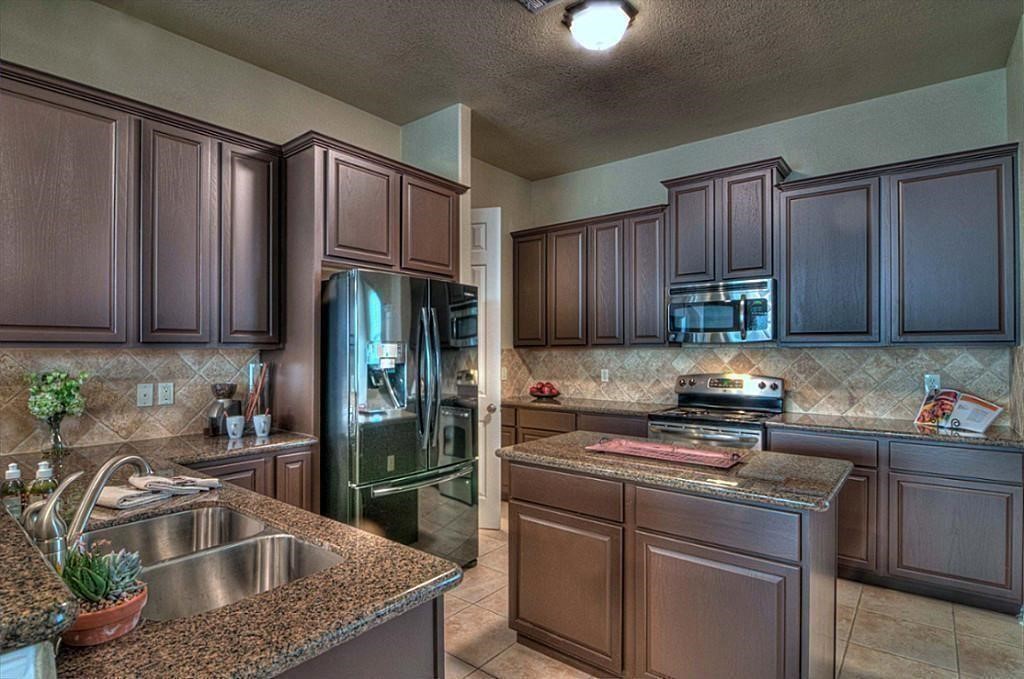 3505 Jackson Street Houston, TX 77004 - Photo 10 of 32 a kitchen with granite countertop a sink stove and refrigerator