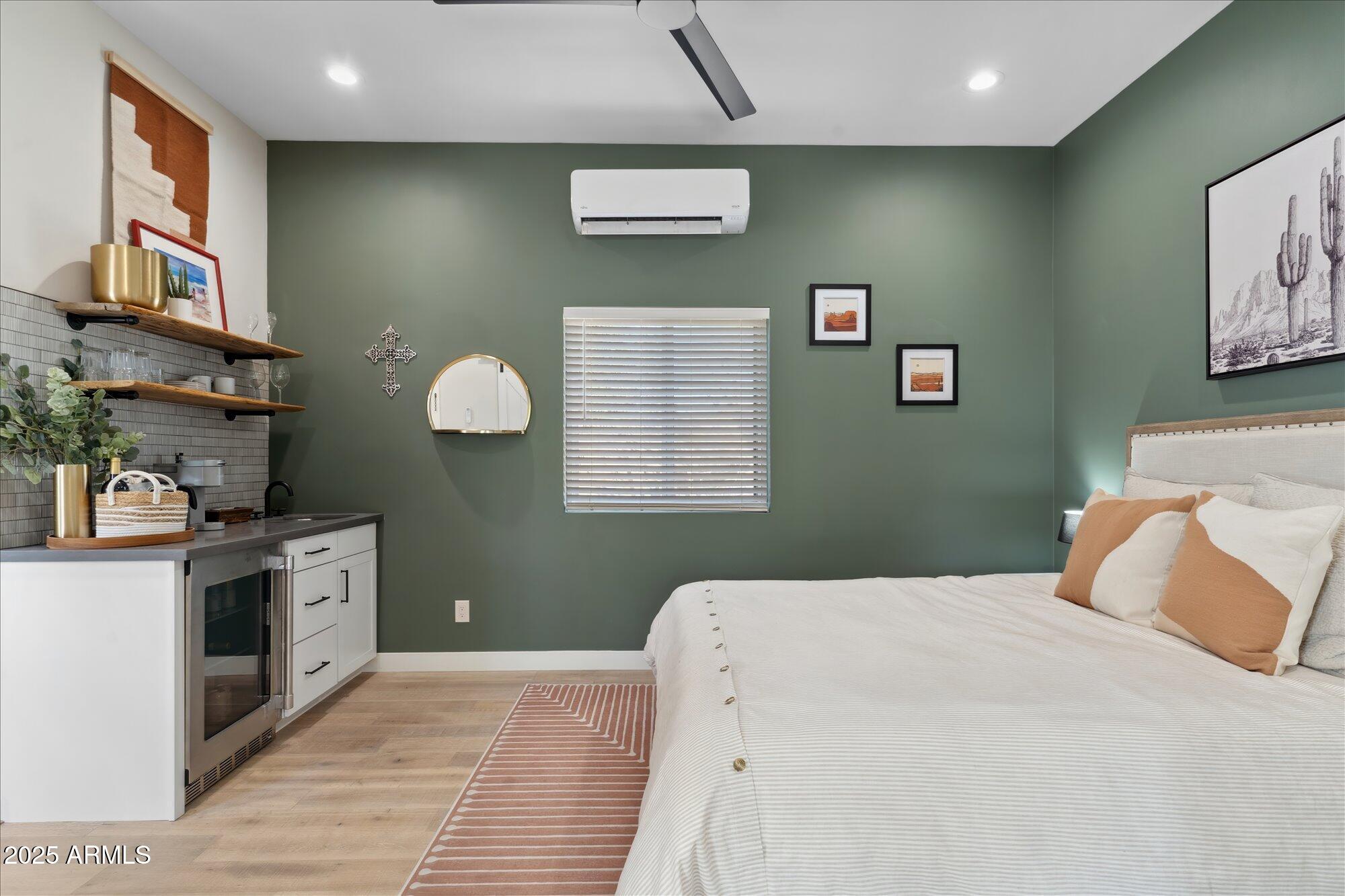 620 West McLellan Boulevard Phoenix, AZ 85013 - Photo 11 of 26 a bedroom with a bed and a kitchen sink