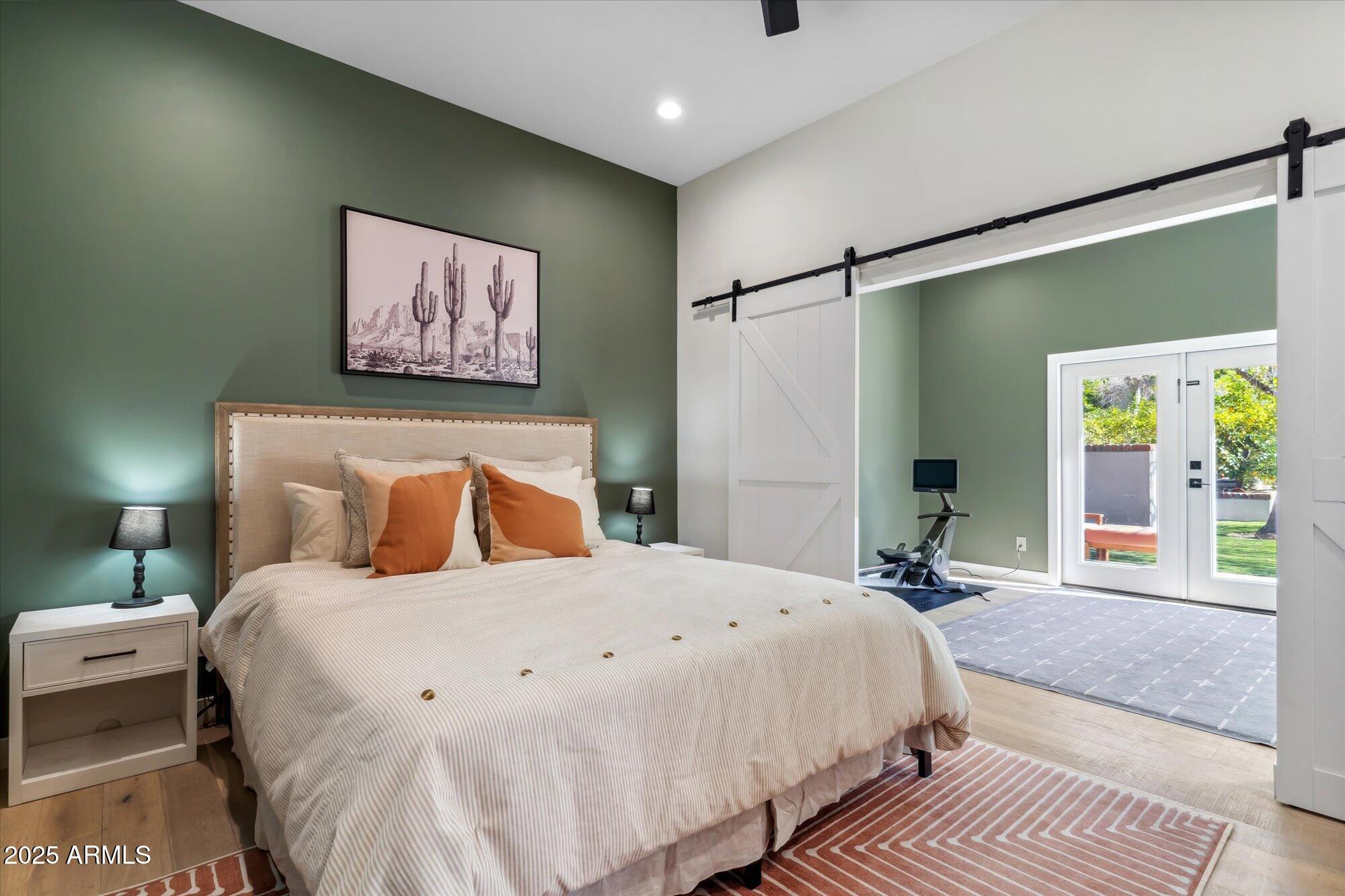 620 West McLellan Boulevard Phoenix, AZ 85013 - Photo 13 of 26 a bed room with a bed and a large mirror