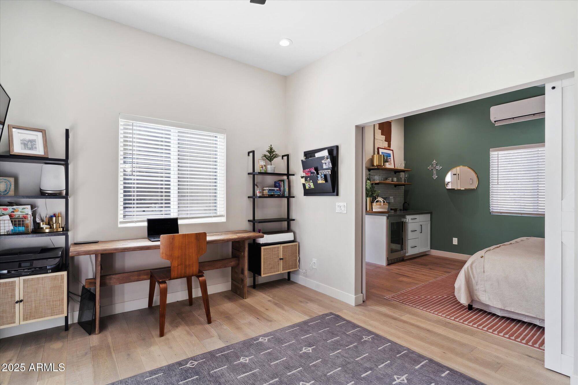 620 West McLellan Boulevard Phoenix, AZ 85013 - Photo 15 of 26 a bedroom with furniture and a book shelf
