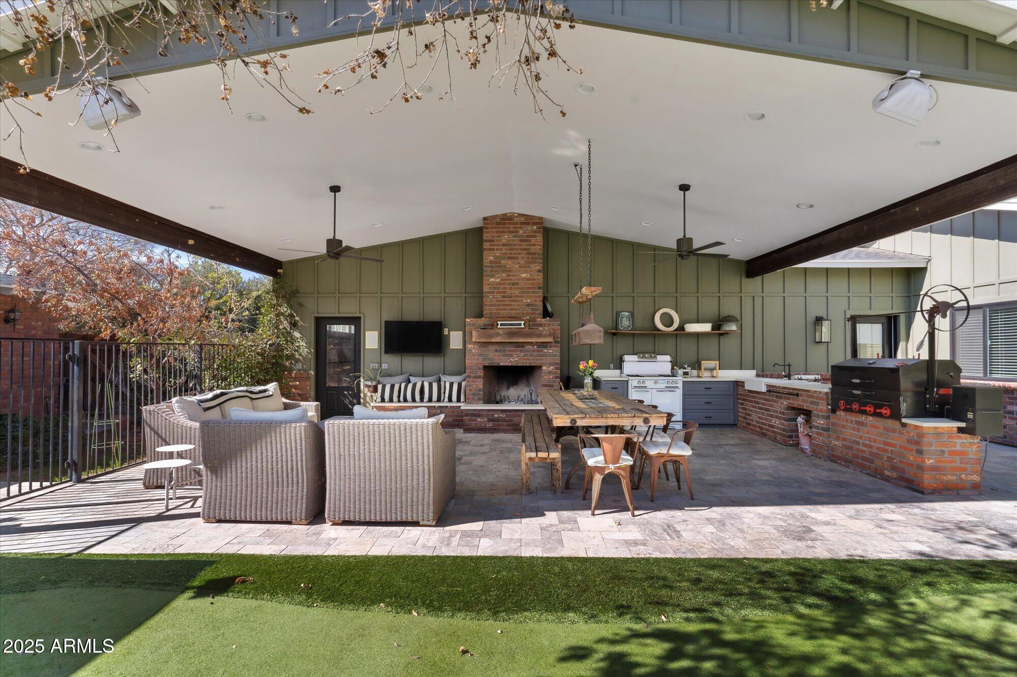 620 West McLellan Boulevard Phoenix, AZ 85013 - Photo 18 of 26 a view of a patio with couches chairs and potted plants
