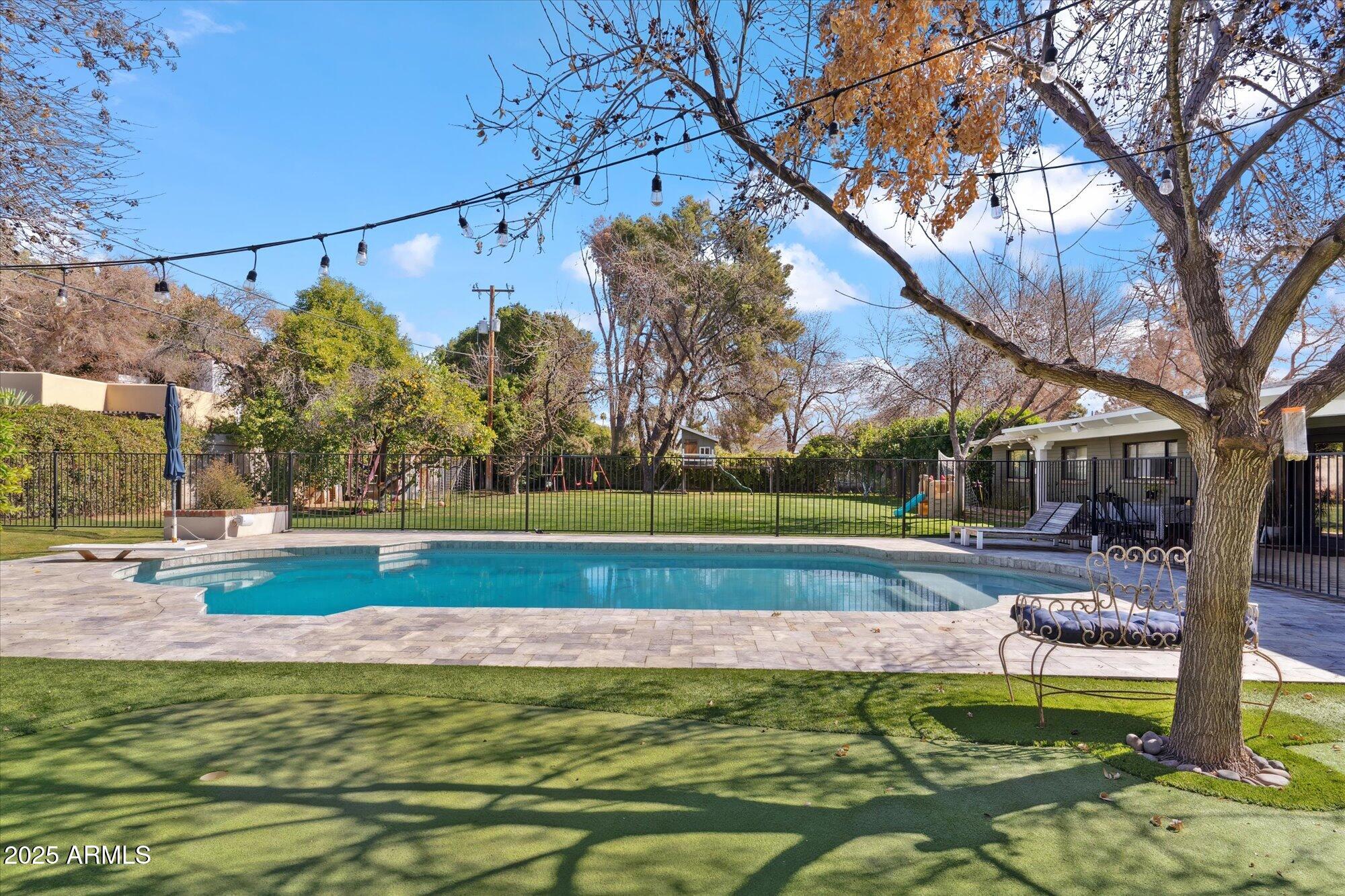 620 West McLellan Boulevard Phoenix, AZ 85013 - Photo 21 of 26 a view of a yard with a swimming pool