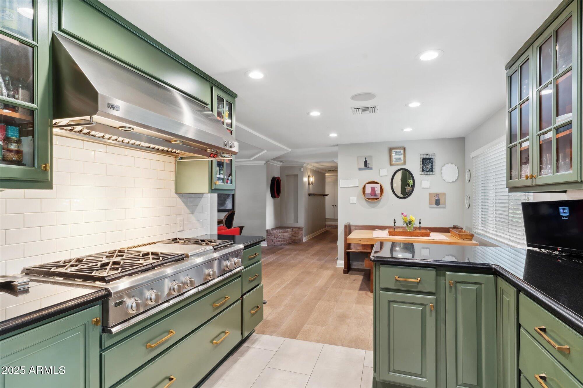 620 West McLellan Boulevard Phoenix, AZ 85013 - Photo 25 of 26 a kitchen with stainless steel appliances granite countertop a stove and a sink