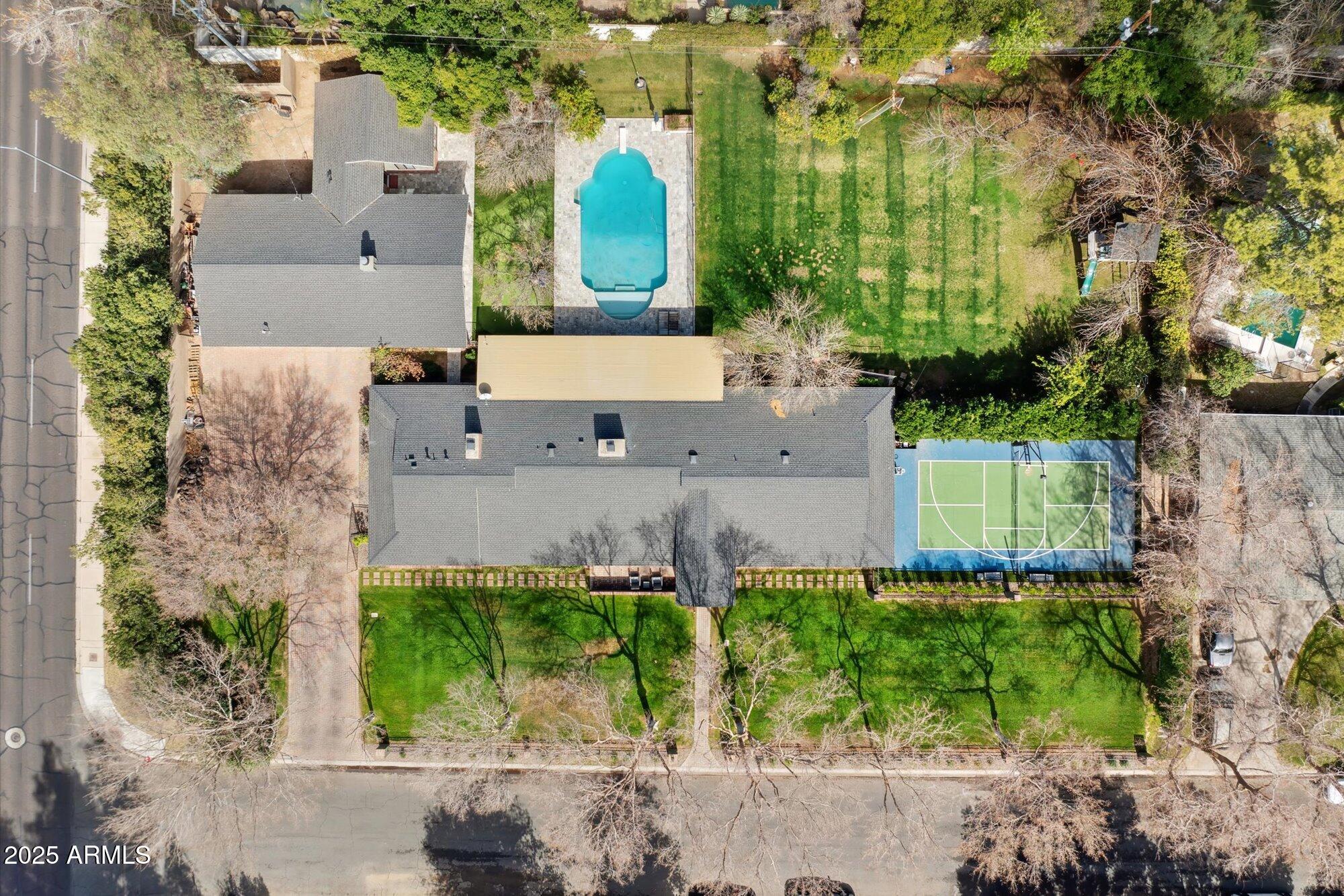 620 West McLellan Boulevard Phoenix, AZ 85013 - Photo 3 of 26 aerial view of a house with a garden and large trees