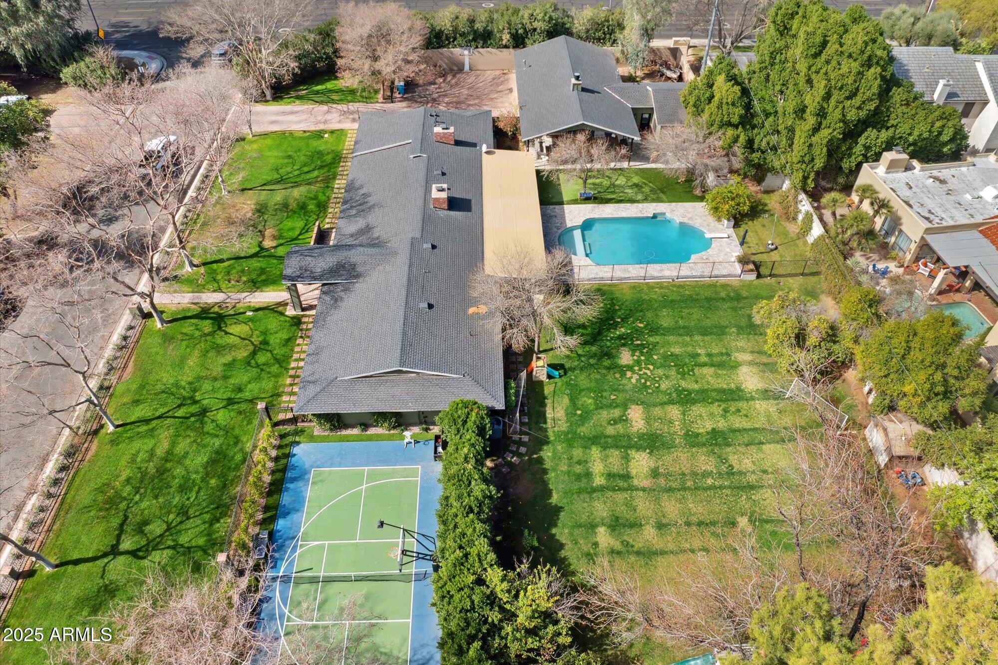 620 West McLellan Boulevard Phoenix, AZ 85013 - Photo 4 of 26 an aerial view of residential houses with outdoor space