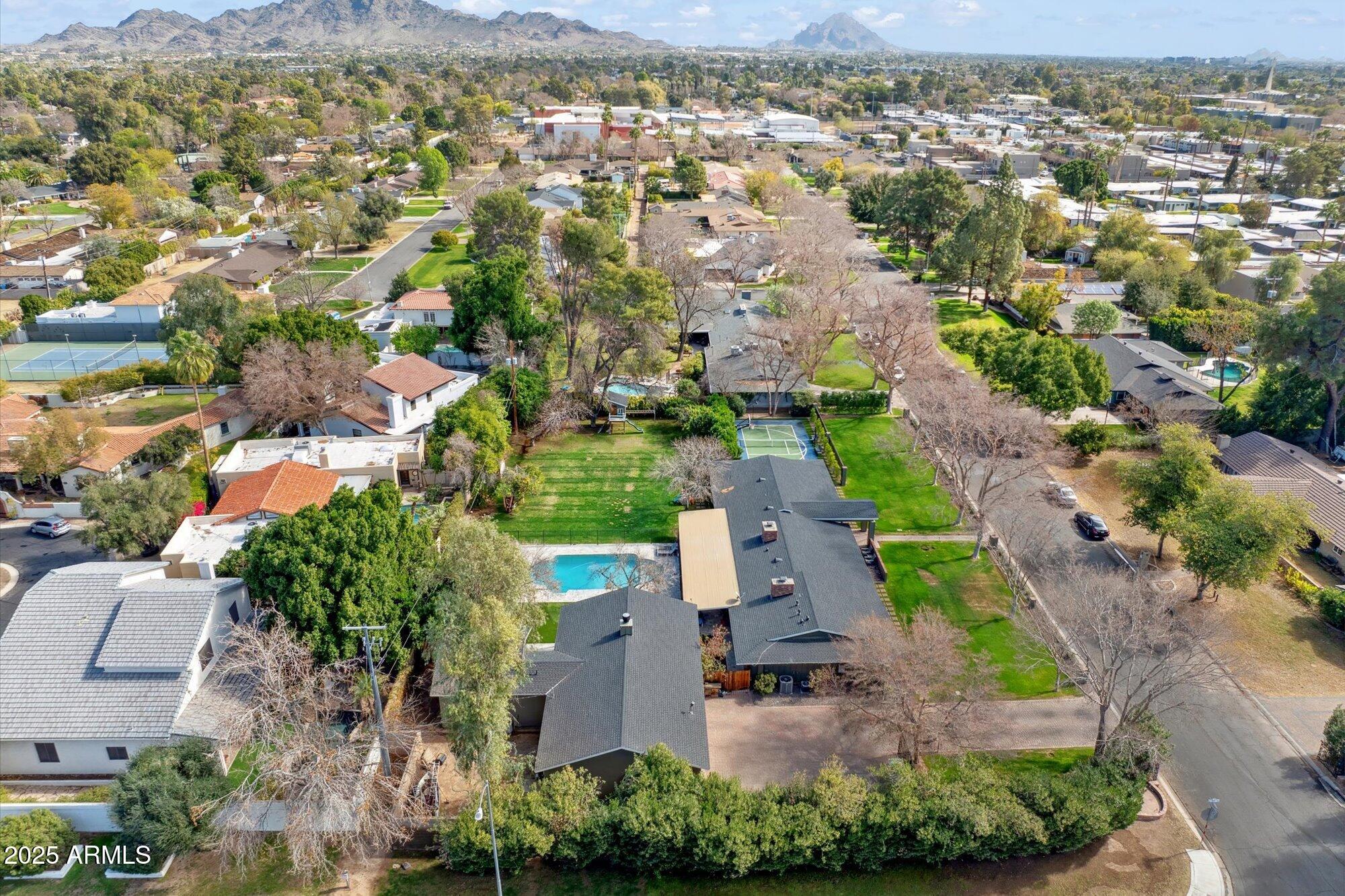 620 West McLellan Boulevard Phoenix, AZ 85013 - Photo 8 of 26 an aerial view of residential houses with outdoor space and mountain view