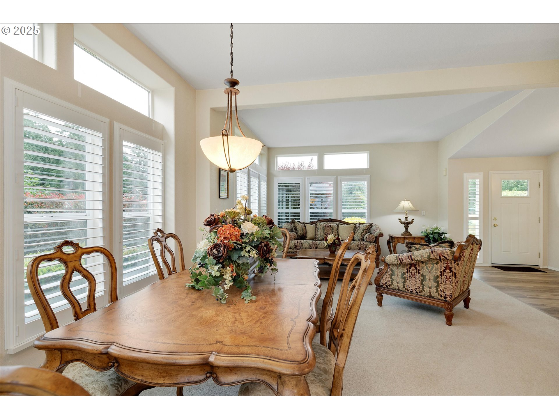 7340-7350 Smith Road Monmouth, OR 97361 - Photo 15 of 40 a view of a dining room with furniture and chandelier