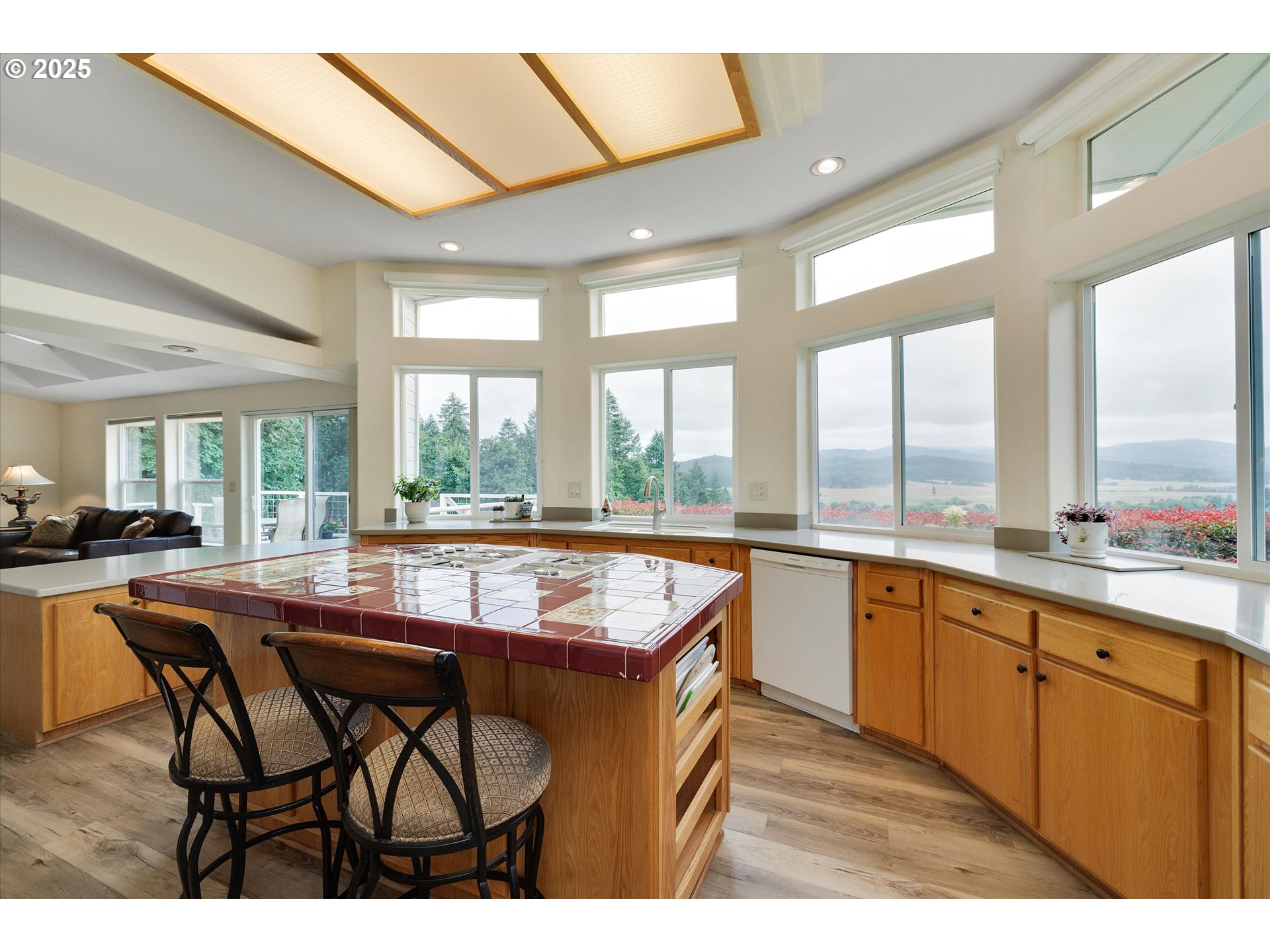 7340-7350 Smith Road Monmouth, OR 97361 - Photo 16 of 40 a dining hall with stainless steel appliances granite countertop a kitchen island a stove and a refrigerator