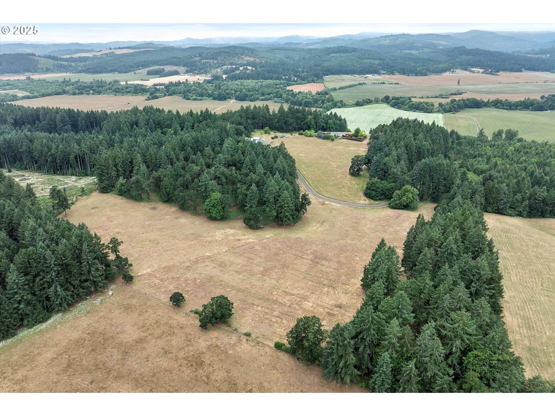 7340-7350 Smith Road Monmouth, OR 97361 - Photo 8 of 40 a view of a lake with mountains and valleys in the background