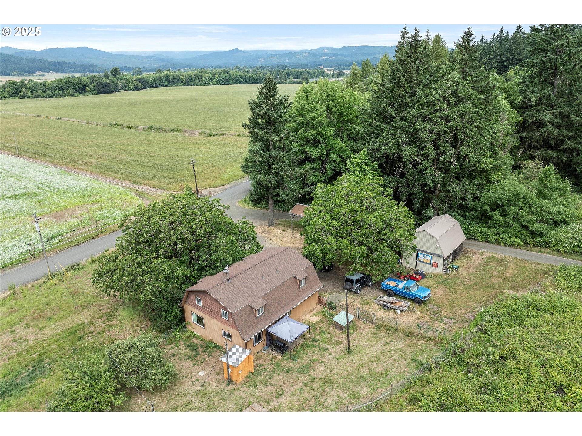 7340-7350 Smith Road Monmouth, OR 97361 - Photo 10 of 40 a backyard of a house with a yard and lake view