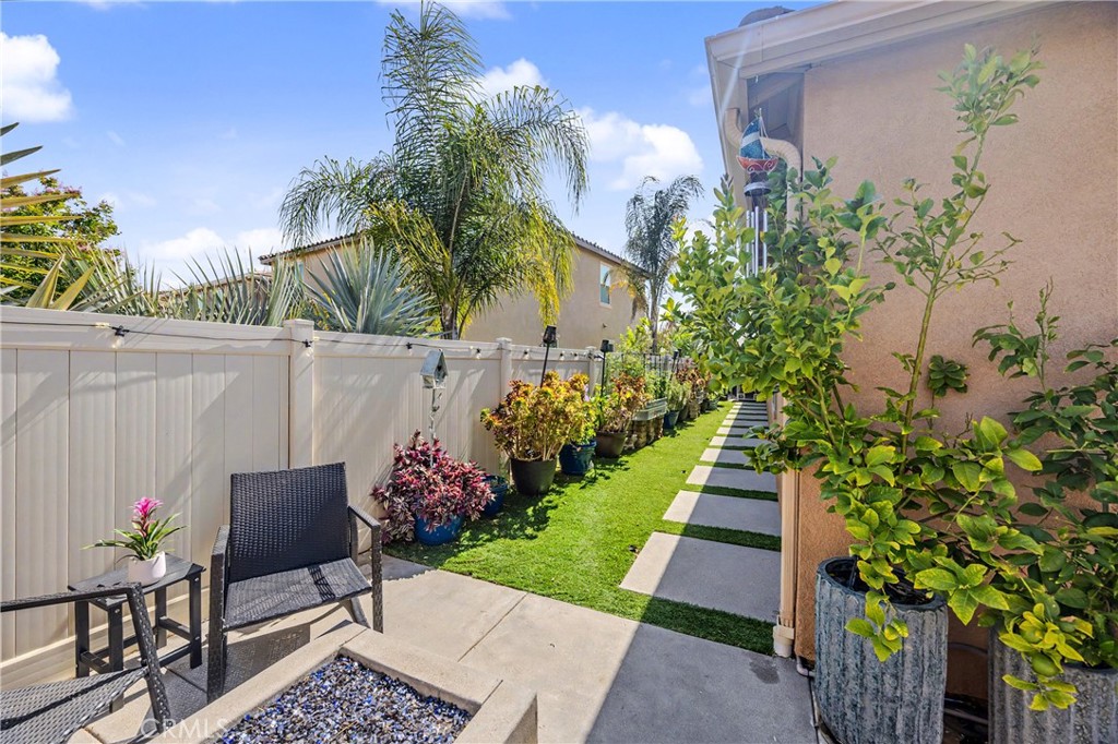 34512 Burnt Pine Road Murrieta, CA 92563 - Photo 14 of 21 a view of a chairs and table in a backyard