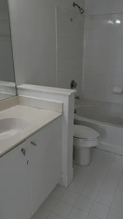 a bathroom with a sink and toilet