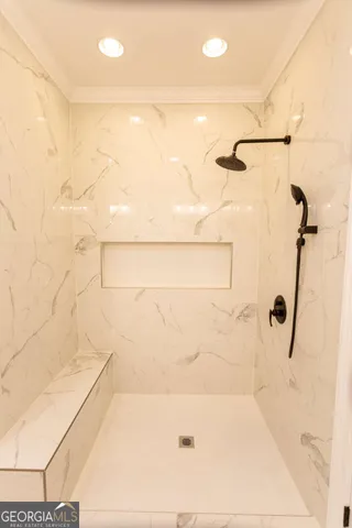 an empty room with a window and wooden floor