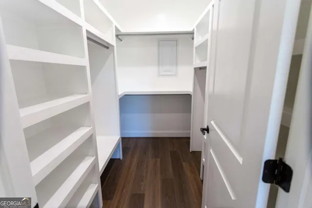 a bathroom with a sink toilet a mirror and shower