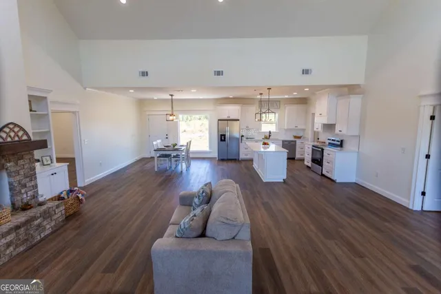 a kitchen with a stove and white cabinets