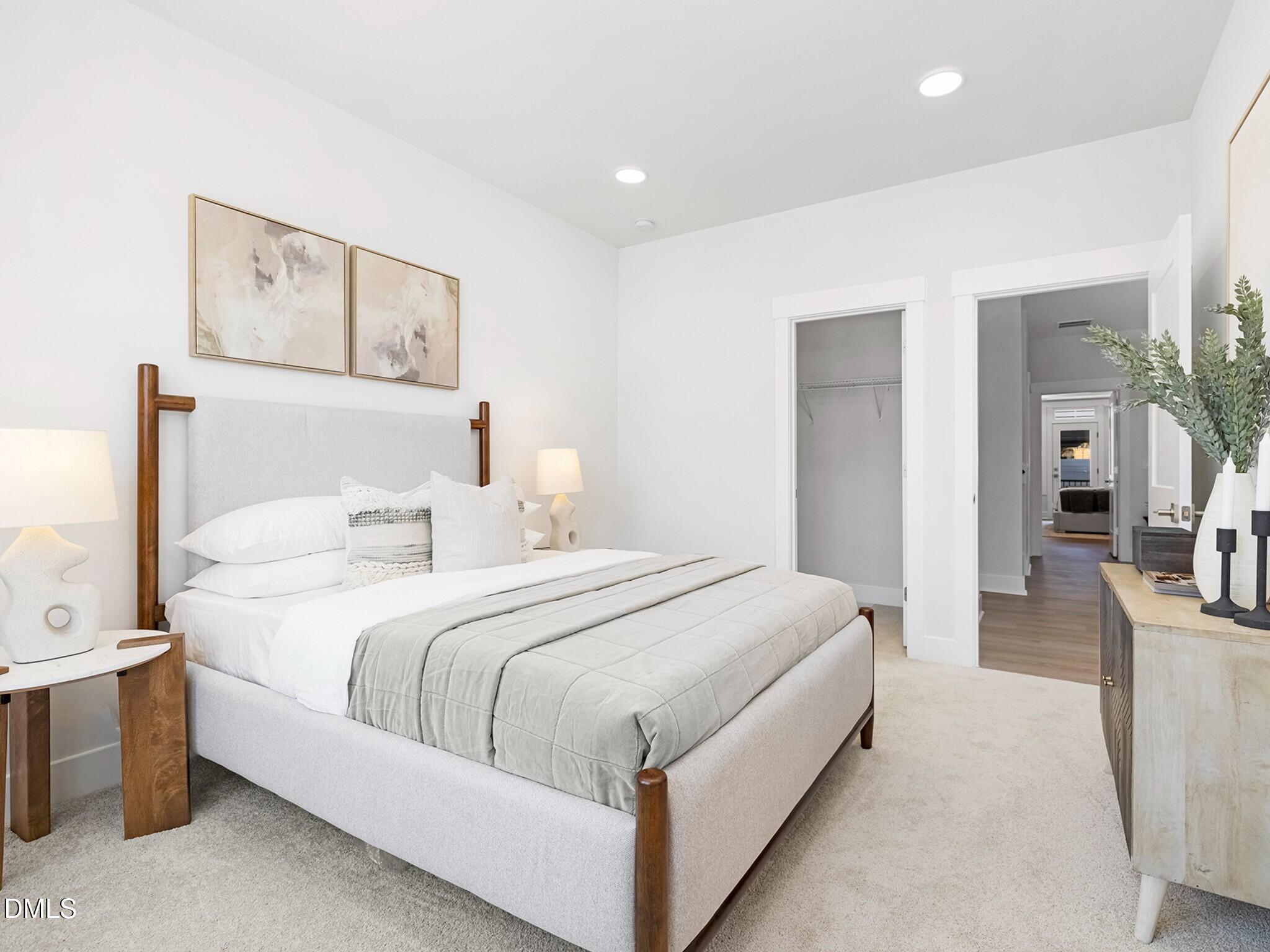 620 Cable Court Apex, NC 27523 - Photo 10 of 10 a bed room with a bed and a painting